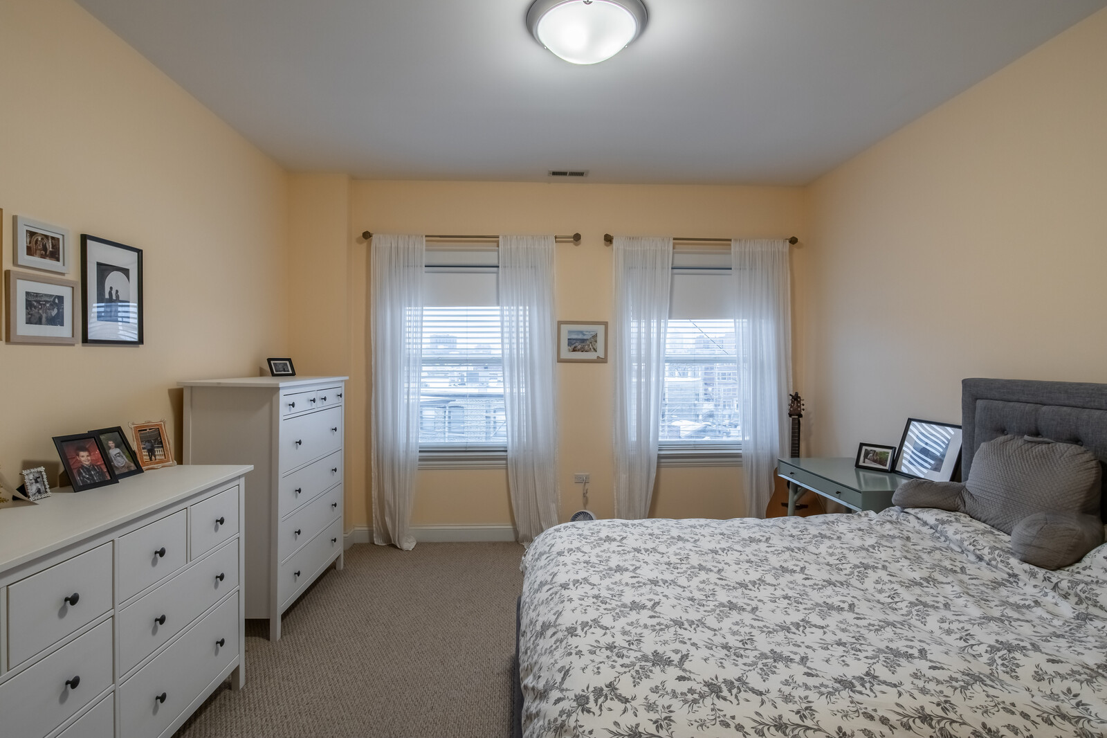3755 North Racine Avenue, Unit 4E Chicago, IL 60613 - Photo 11 of 29 a bedroom with furniture and a window