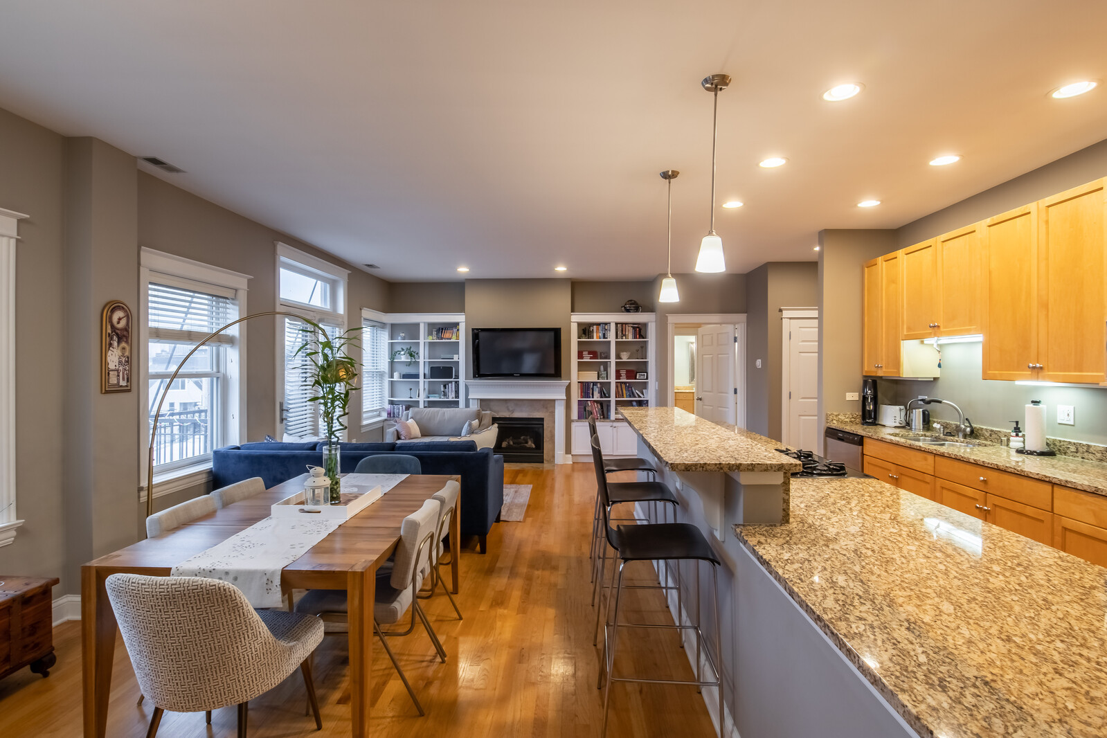 3755 North Racine Avenue, Unit 4E Chicago, IL 60613 - Photo 2 of 29 a view of a dining room and livingroom with furniture wooden floor a chandelier
