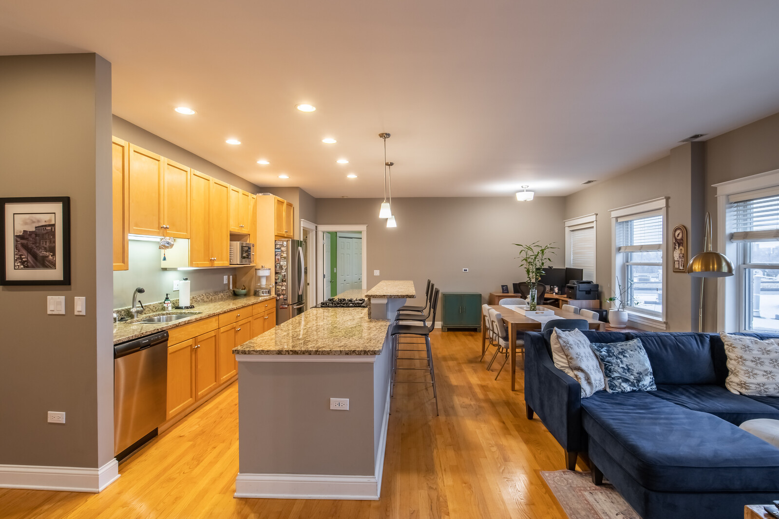 3755 North Racine Avenue, Unit 4E Chicago, IL 60613 - Photo 7 of 29 a living room with stainless steel appliances kitchen island granite countertop furniture and a kitchen view