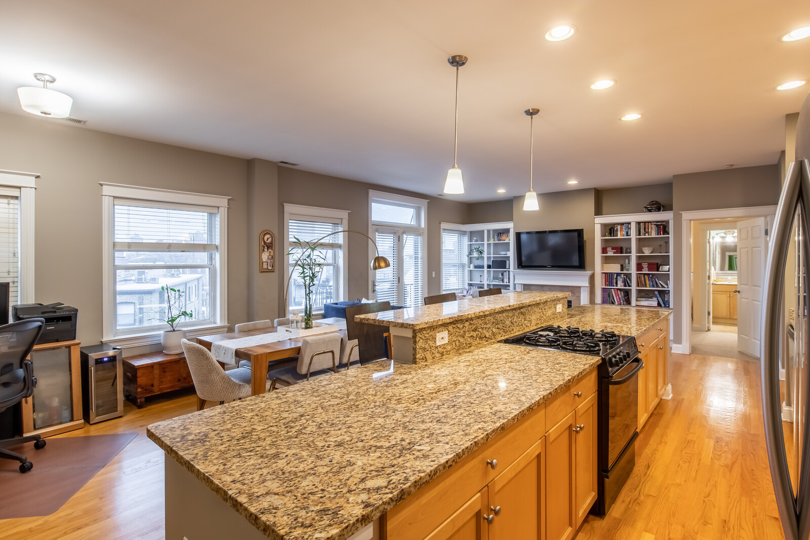 3755 North Racine Avenue, Unit 4E Chicago, IL 60613 - Photo 8 of 29 a kitchen with stainless steel appliances granite countertop a stove and cabinets