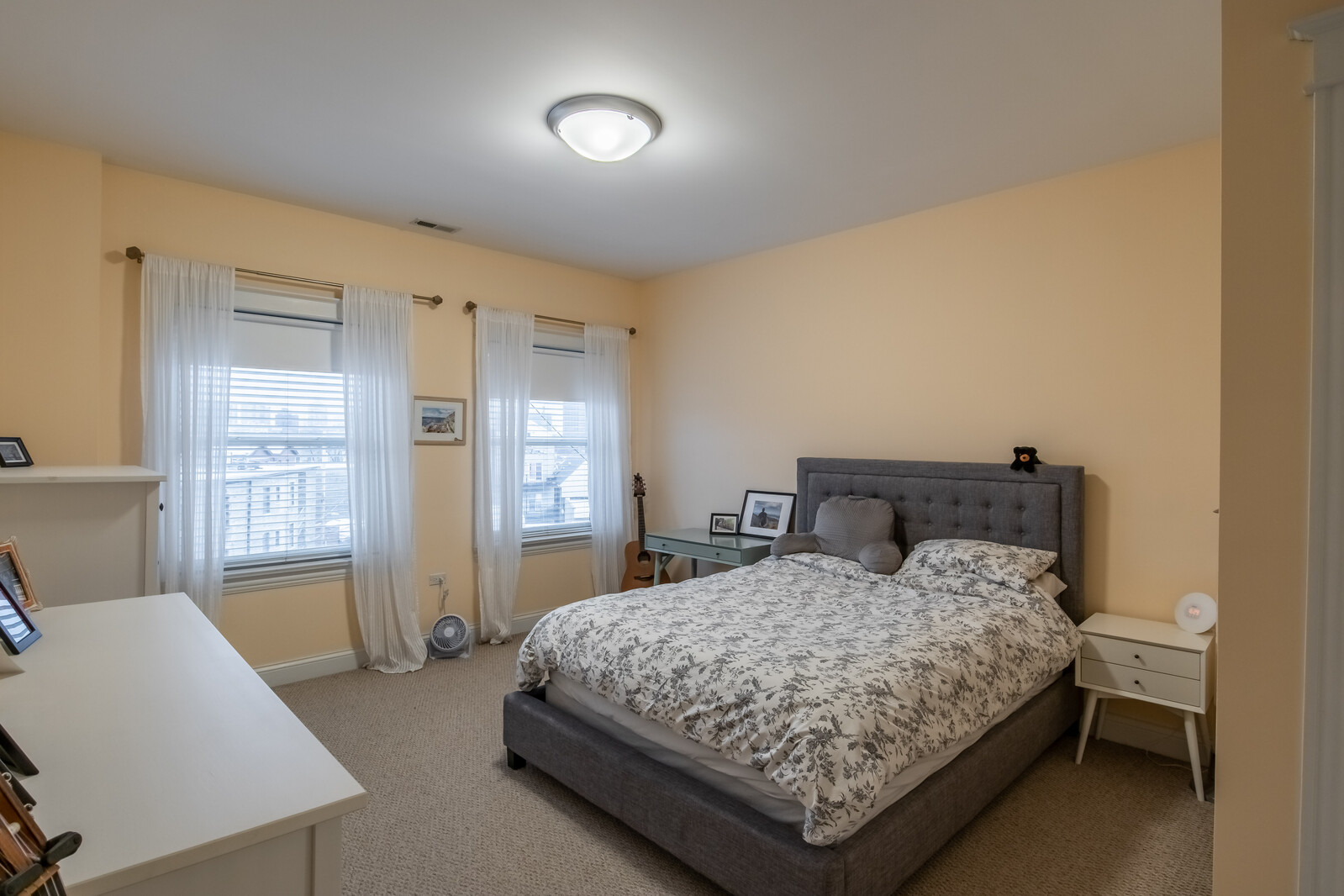 3755 North Racine Avenue, Unit 4E Chicago, IL 60613 - Photo 10 of 29 a bedroom with a bed and a window