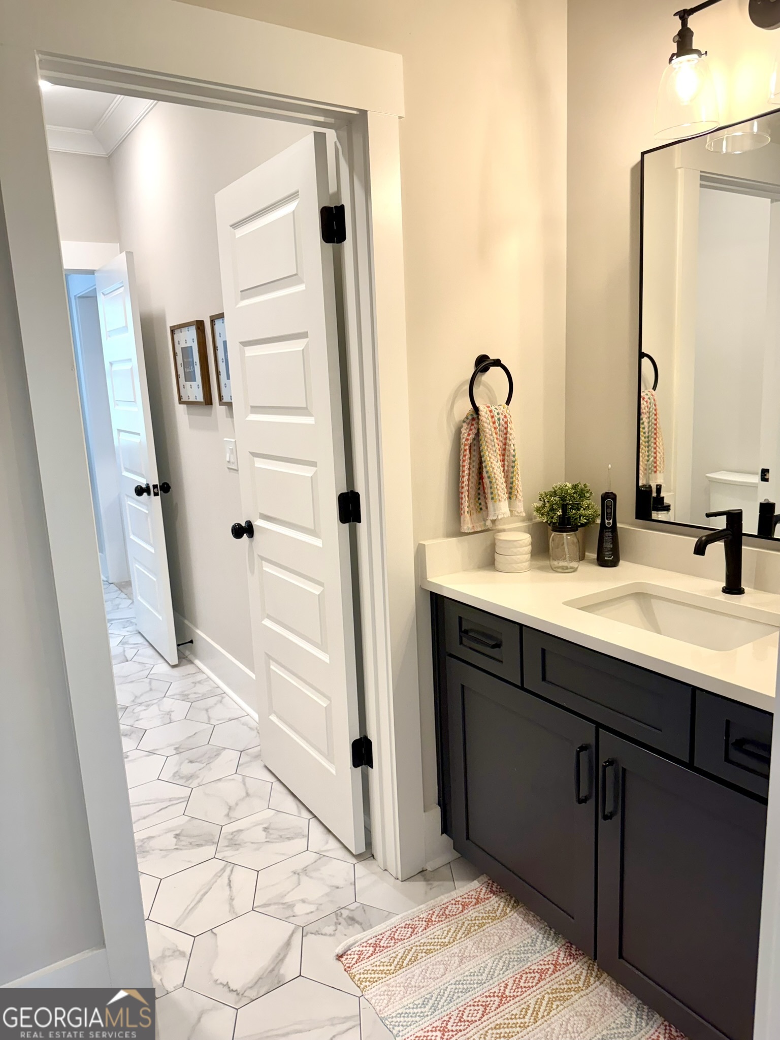 120 Spring Creek Drive Rutledge, GA 30663 - Photo 32 of 38 a bathroom with a sink and a mirror
