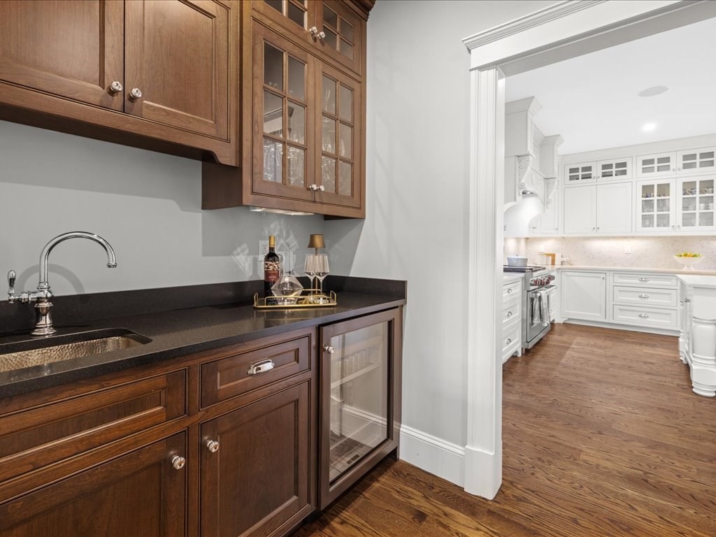 241 Bristol Road Wellesley, MA 02481 - Photo 14 of 42 a kitchen with stainless steel appliances granite countertop a sink and cabinets