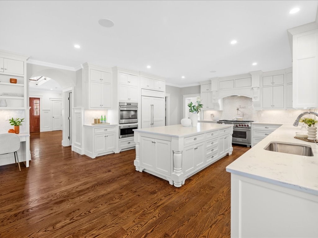 241 Bristol Road Wellesley, MA 02481 - Photo 16 of 42 a kitchen with white cabinets and stainless steel appliances