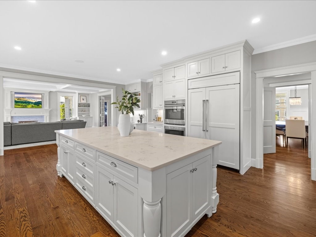 241 Bristol Road Wellesley, MA 02481 - Photo 17 of 42 a large white kitchen with wooden floor