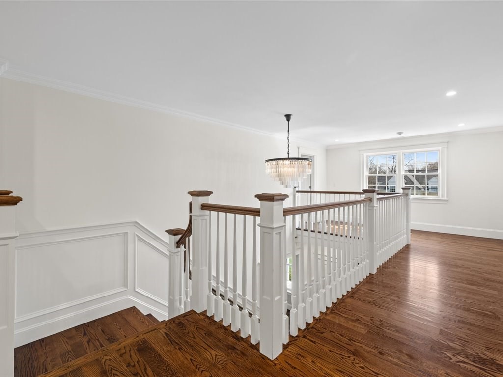241 Bristol Road Wellesley, MA 02481 - Photo 20 of 42 a view of a hallway with wooden floor and stairs