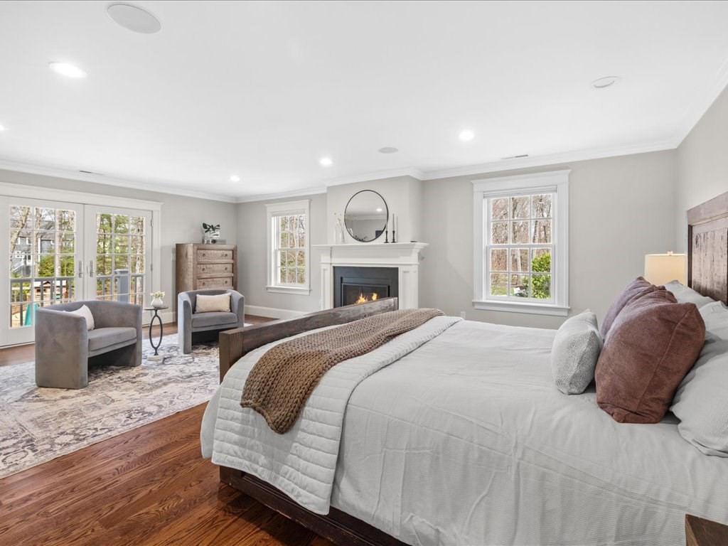 241 Bristol Road Wellesley, MA 02481 - Photo 24 of 42 a bedroom with a large bed and a couch