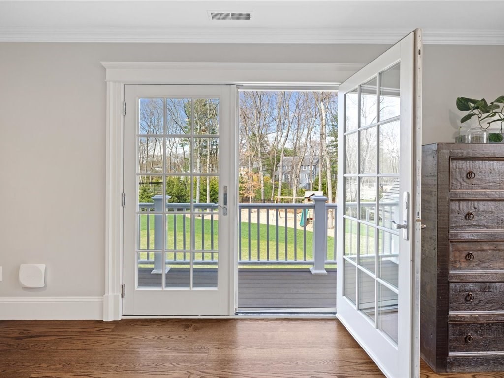 241 Bristol Road Wellesley, MA 02481 - Photo 26 of 42 a view of wooden floor and windows in a room