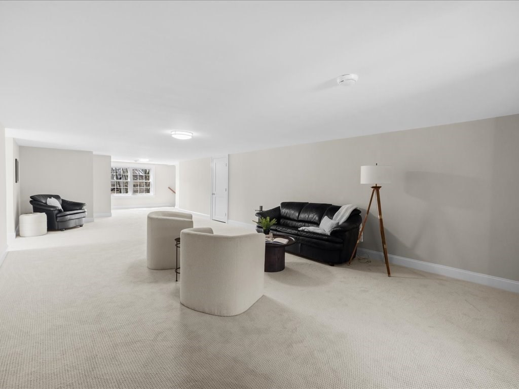 241 Bristol Road Wellesley, MA 02481 - Photo 33 of 42 a living room with furniture and a gym