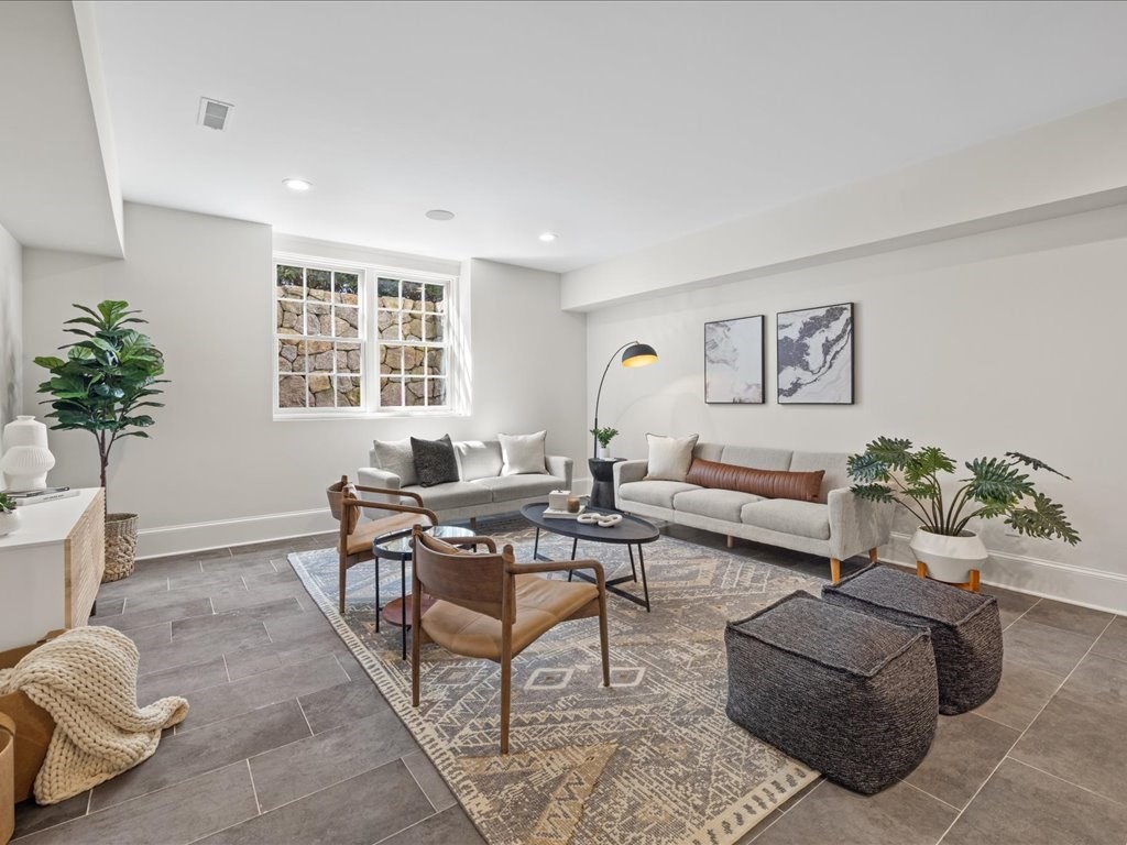 241 Bristol Road Wellesley, MA 02481 - Photo 36 of 42 a living room with furniture potted plant and a window