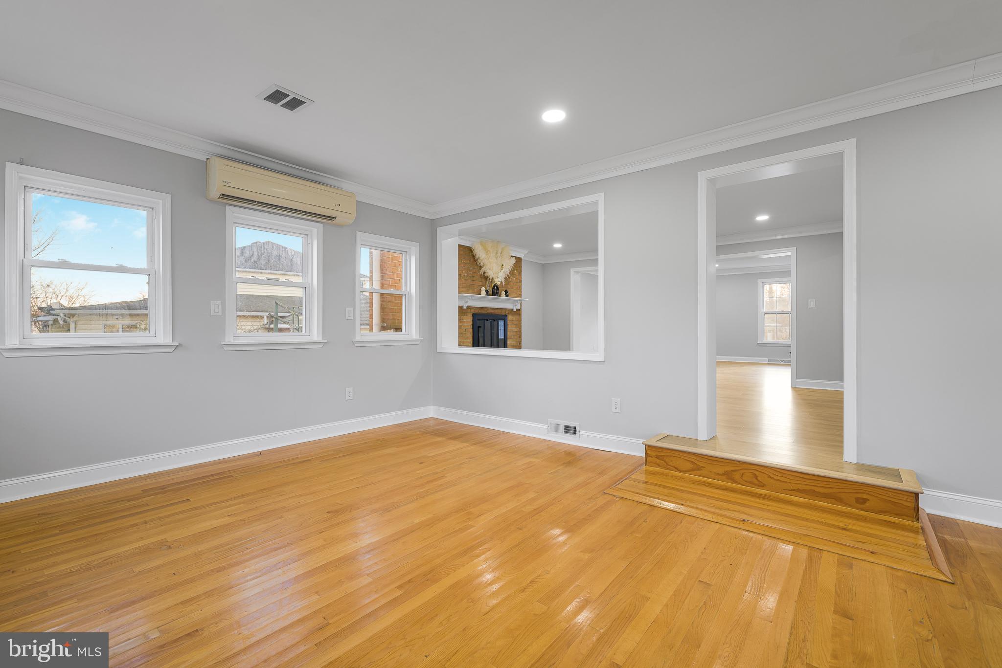 2205 Dorval Road Wilmington, DE 19810 - Photo 12 of 45 a view of an empty room with wooden floor and a window