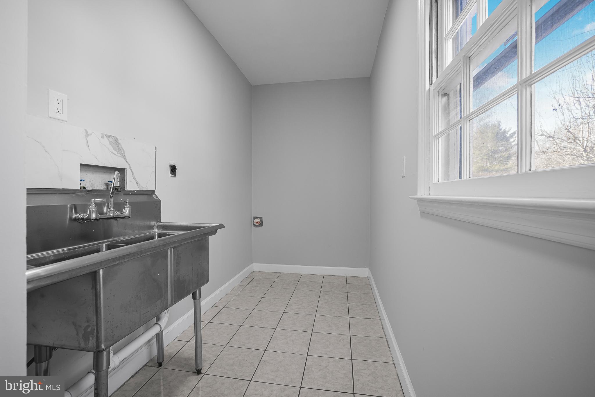 2205 Dorval Road Wilmington, DE 19810 - Photo 22 of 45 a kitchen with stainless steel appliances a sink and cabinets