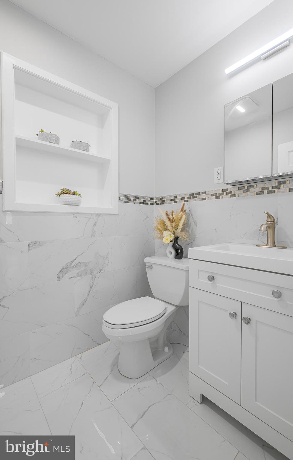 2205 Dorval Road Wilmington, DE 19810 - Photo 31 of 45 a bathroom with a sink a toilet and vanity