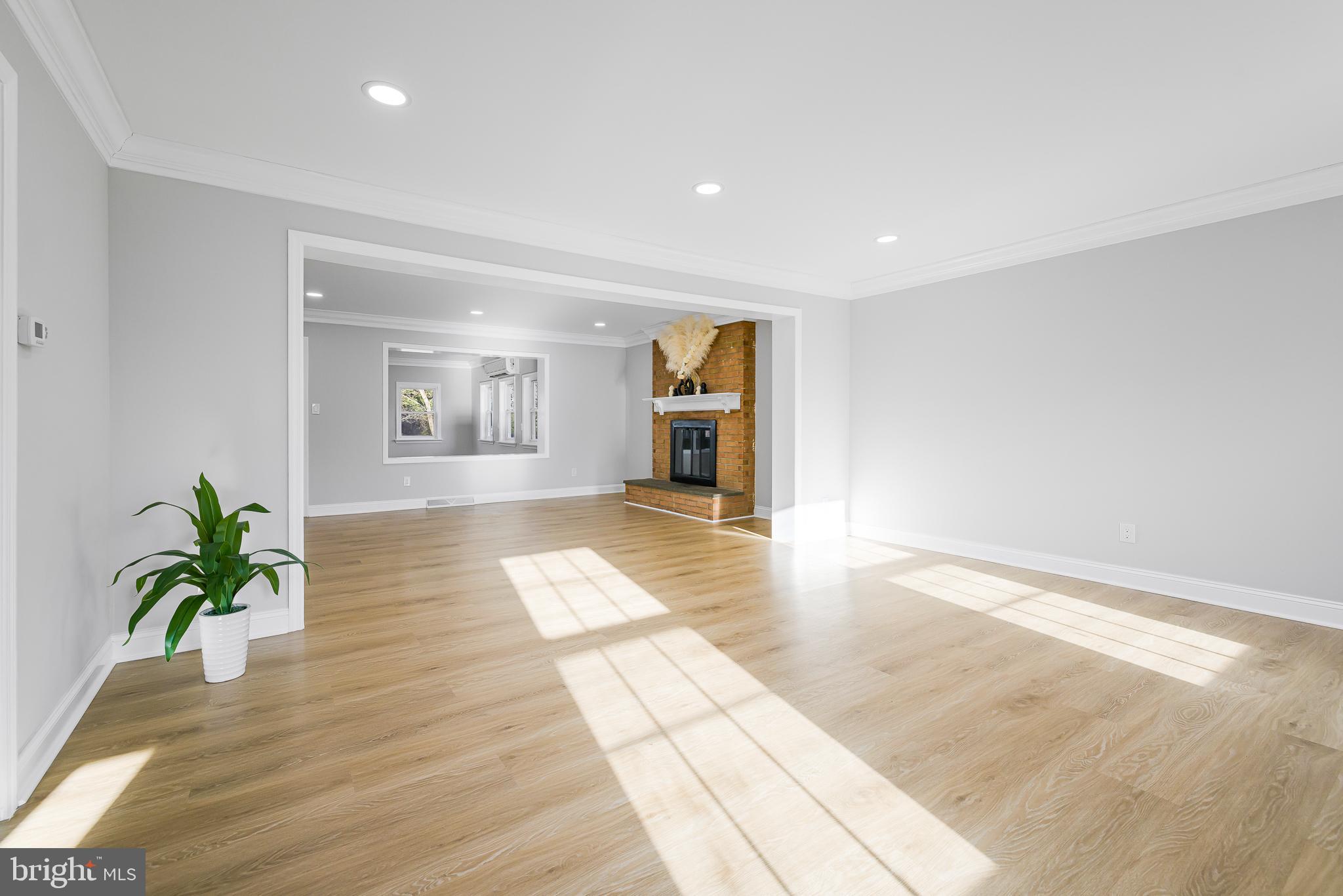 2205 Dorval Road Wilmington, DE 19810 - Photo 9 of 45 a view of an empty room with wooden floor and a window