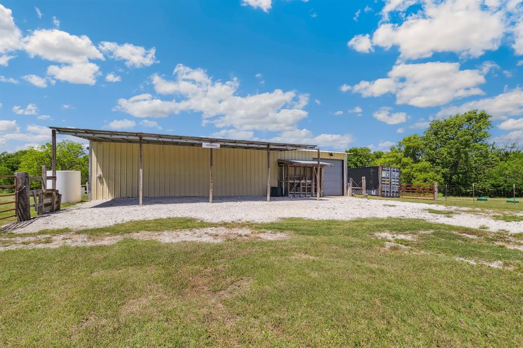 891 Shahan Prairie Road Little Elm, TX 75068 - Photo 16 of 21 a view of a house with swimming pool and a yard