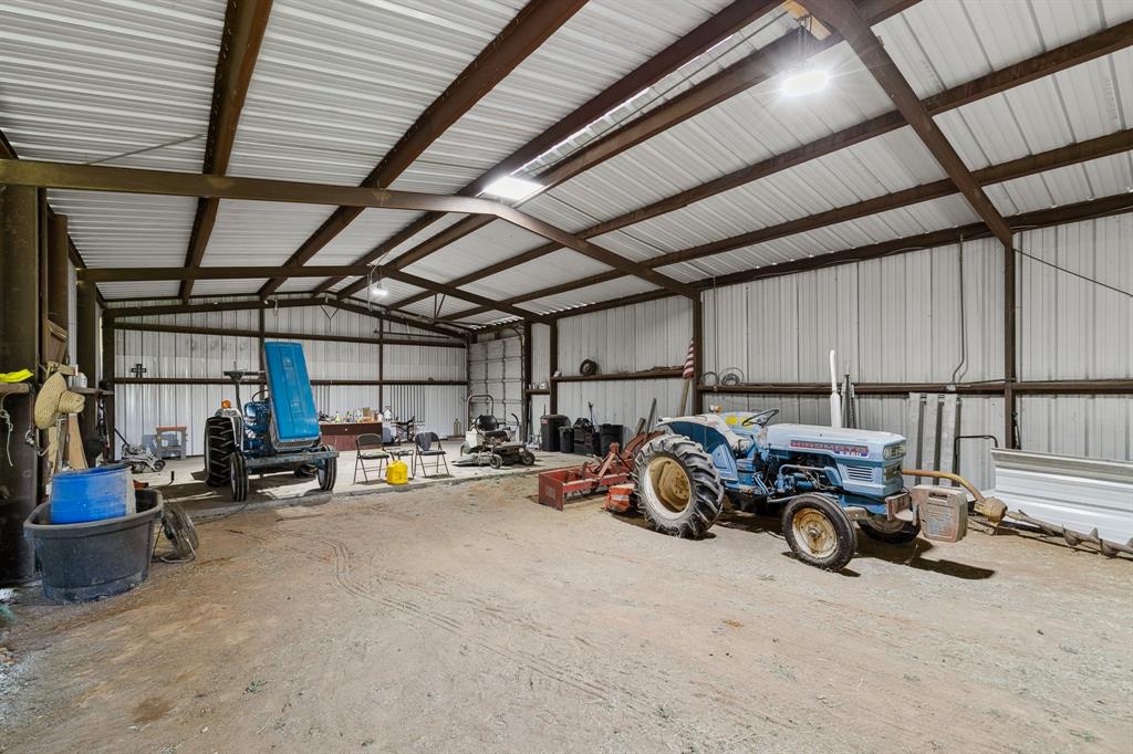 891 Shahan Prairie Road Little Elm, TX 75068 - Photo 17 of 21 a view of a garage with parked cars