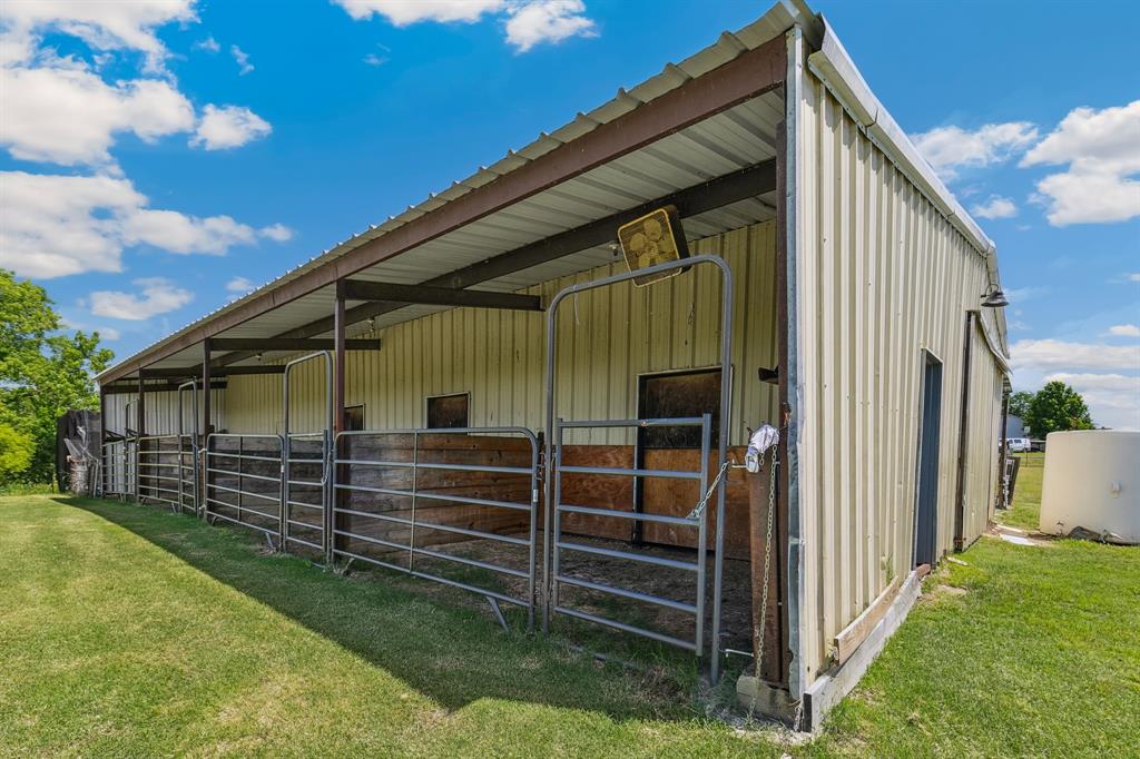 891 Shahan Prairie Road Little Elm, TX 75068 - Photo 18 of 21 a front view of a house with a garden