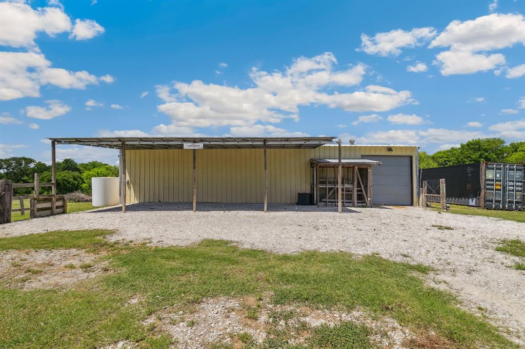 891 Shahan Prairie Road Little Elm, TX 75068 - Photo 19 of 21 a front view of a house with a yard and garage