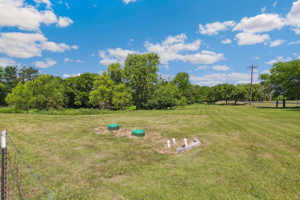 891 Shahan Prairie Road Little Elm, TX 75068 - Photo 7 of 21 a view of a lake with houses in the background