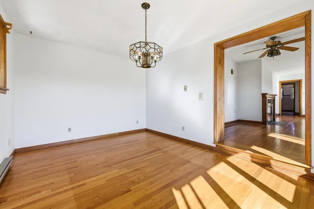 a kitchen with a sink a refrigerator and cabinets