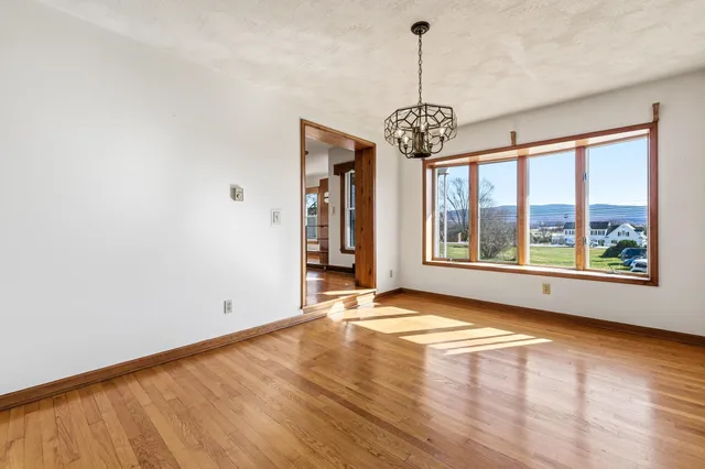 a kitchen with stainless steel appliances granite countertop a refrigerator sink and stove