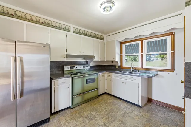 a kitchen with a stove and a refrigerator