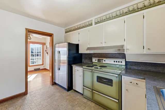 a kitchen with granite countertop a sink and a window