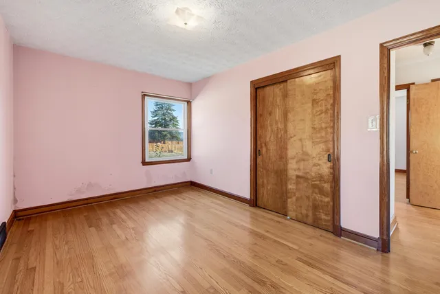 a bathroom with a sink a toilet and a window