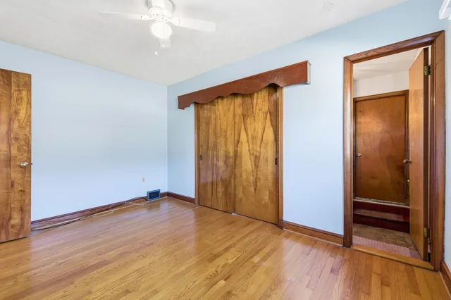 a view of a livingroom with furniture and a window