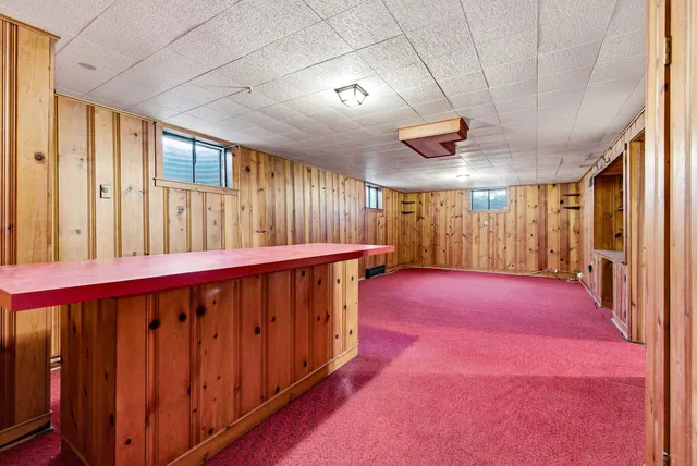 a view of storage and utility room with wooden racks