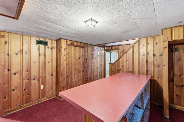a view of a chair and table in front of a house