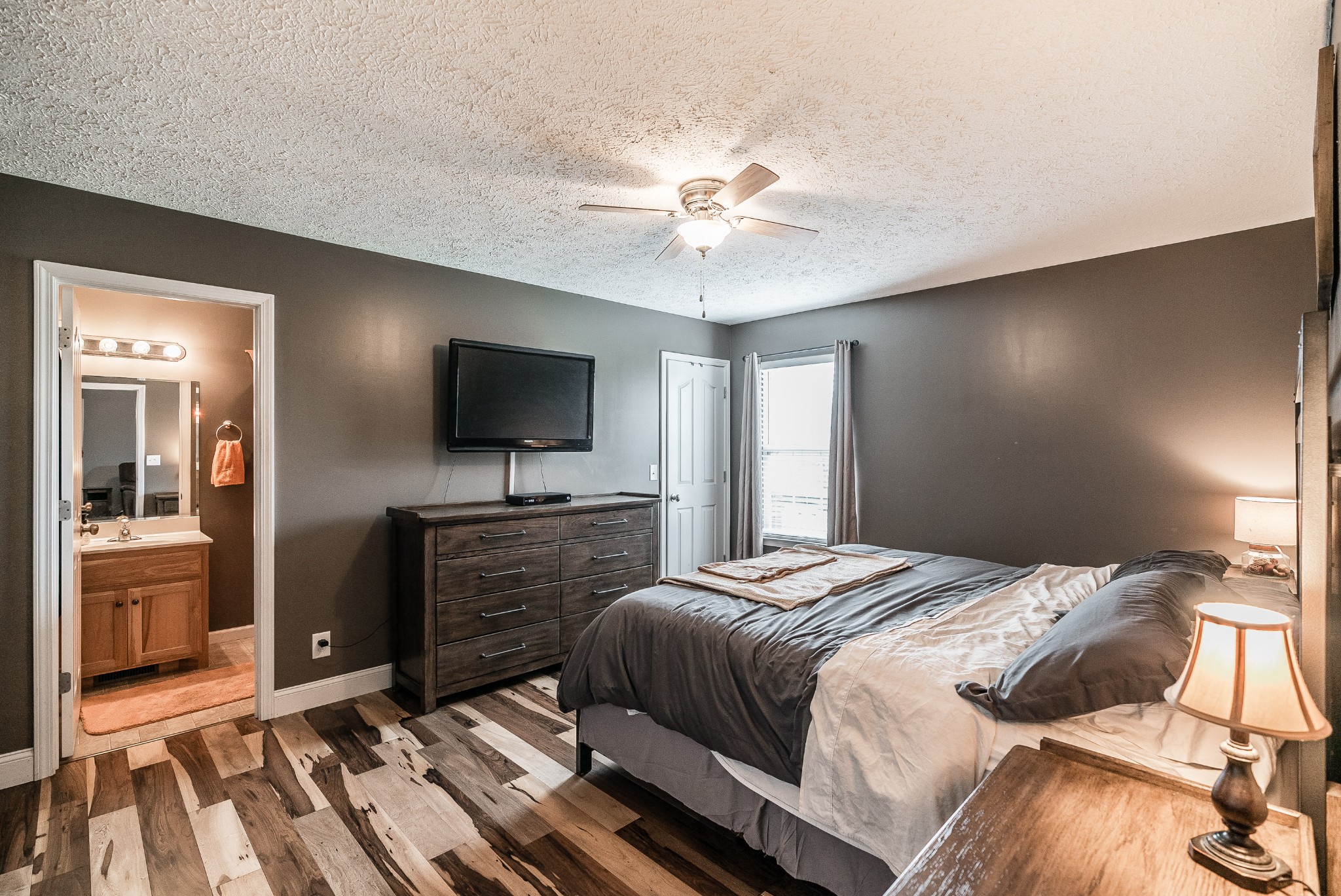 612 Denning Ford Road Portland, TN 37148 - Photo 8 of 26 a bedroom with a bed and a flat screen tv