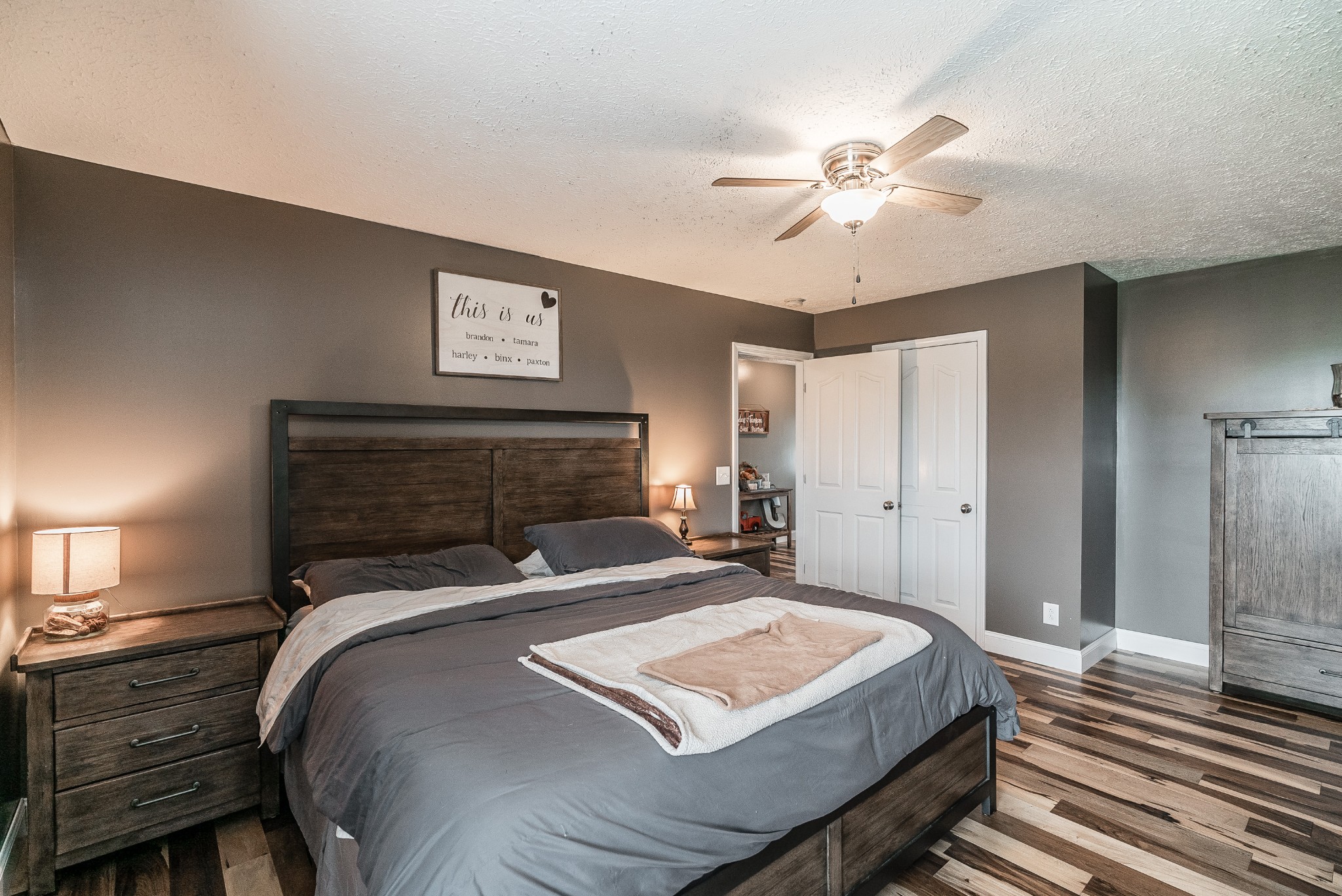 612 Denning Ford Road Portland, TN 37148 - Photo 10 of 26 a bedroom with a bed and a chandelier
