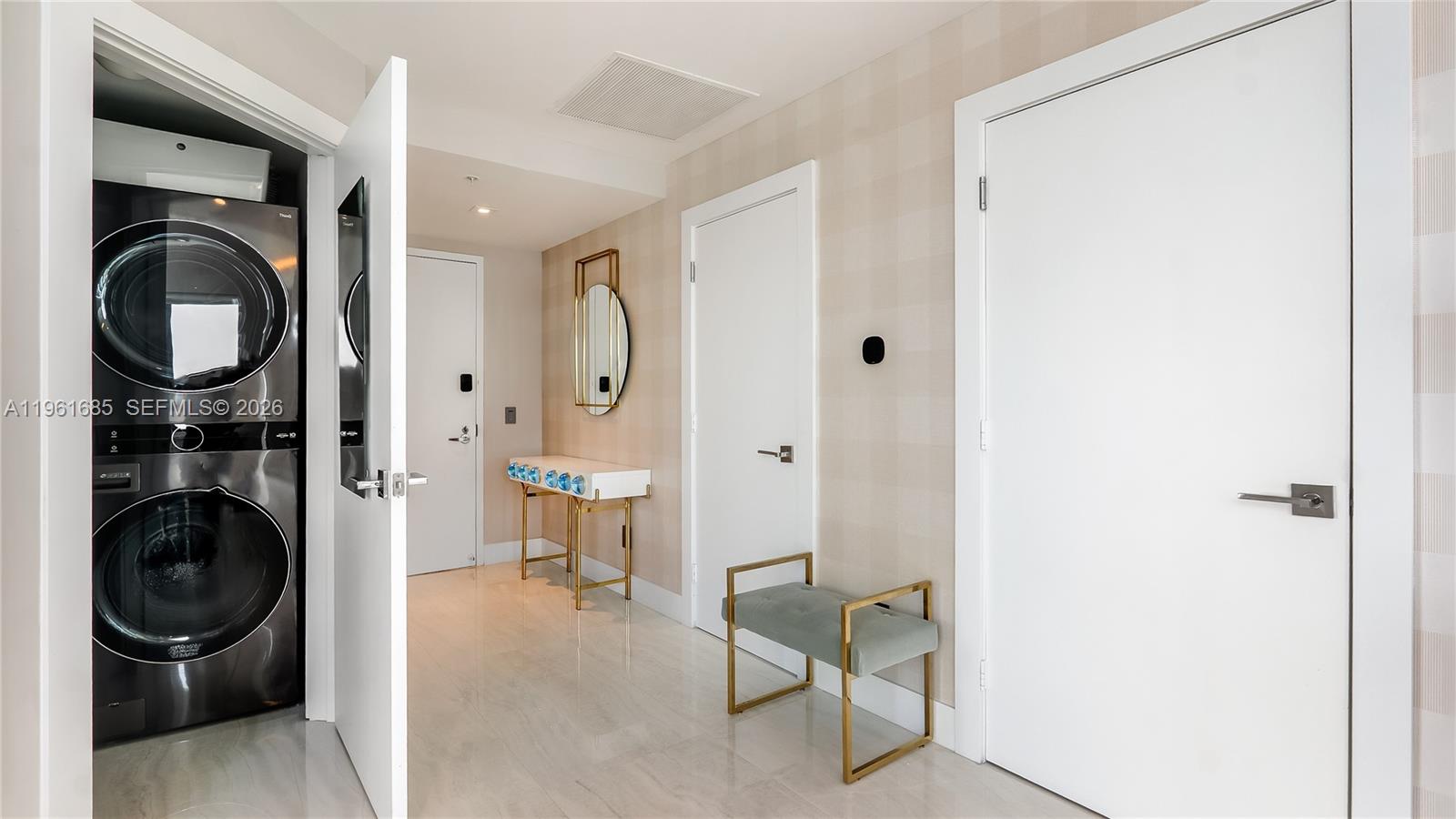 60 Southwest 13th Street, Unit 4200 Miami, FL 33130 - Photo 10 of 52 a view of a hallway with washer and dryer