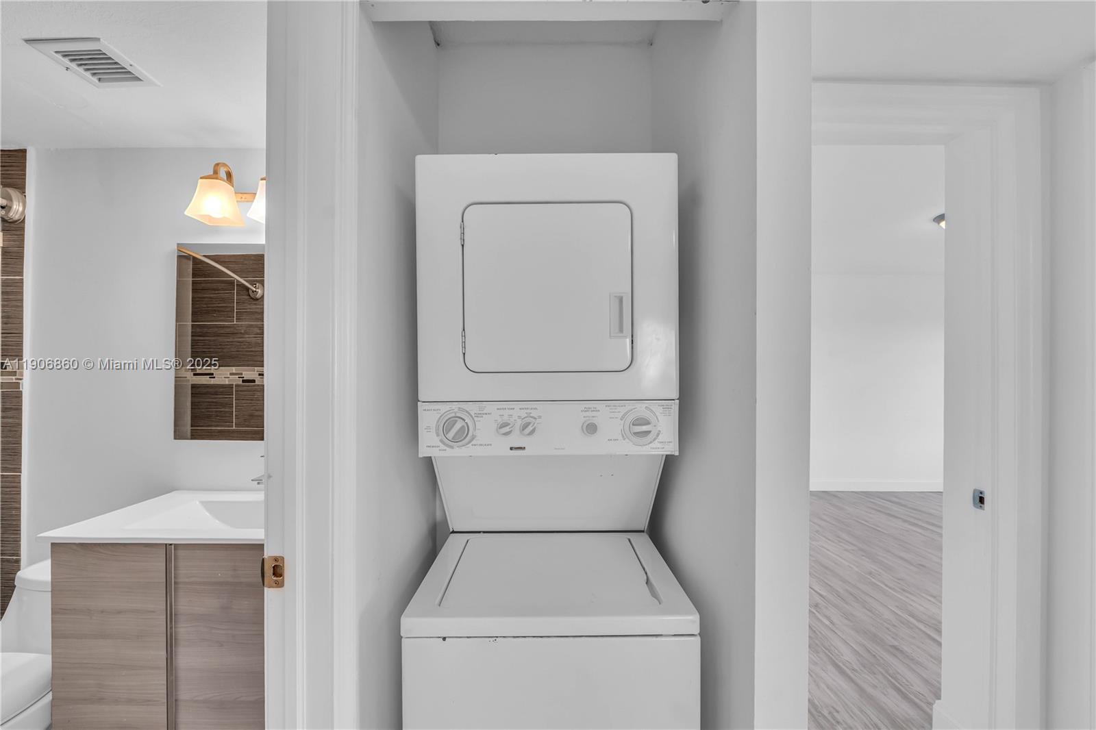 4164 Inverrary Drive, Unit 801 Lauderhill, FL 33319 - Photo 11 of 20 a utility room with dryer and washer