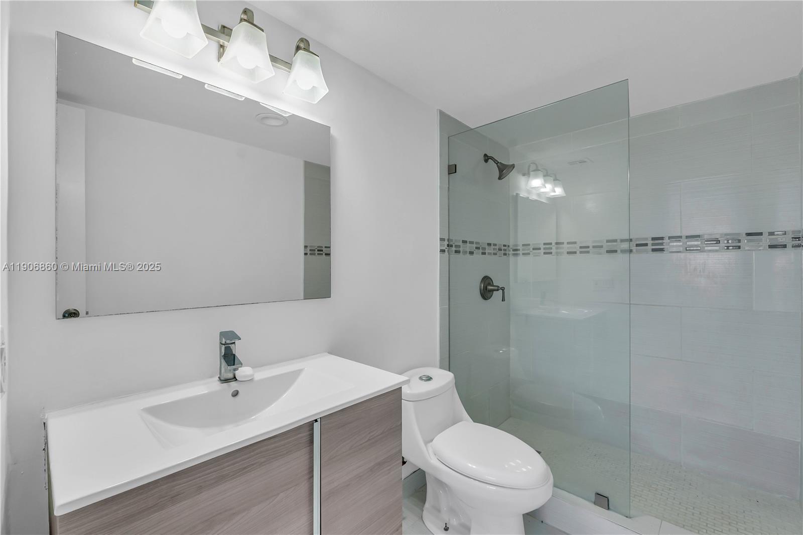 4164 Inverrary Drive, Unit 801 Lauderhill, FL 33319 - Photo 16 of 20 a bathroom with a sink a toilet and shower