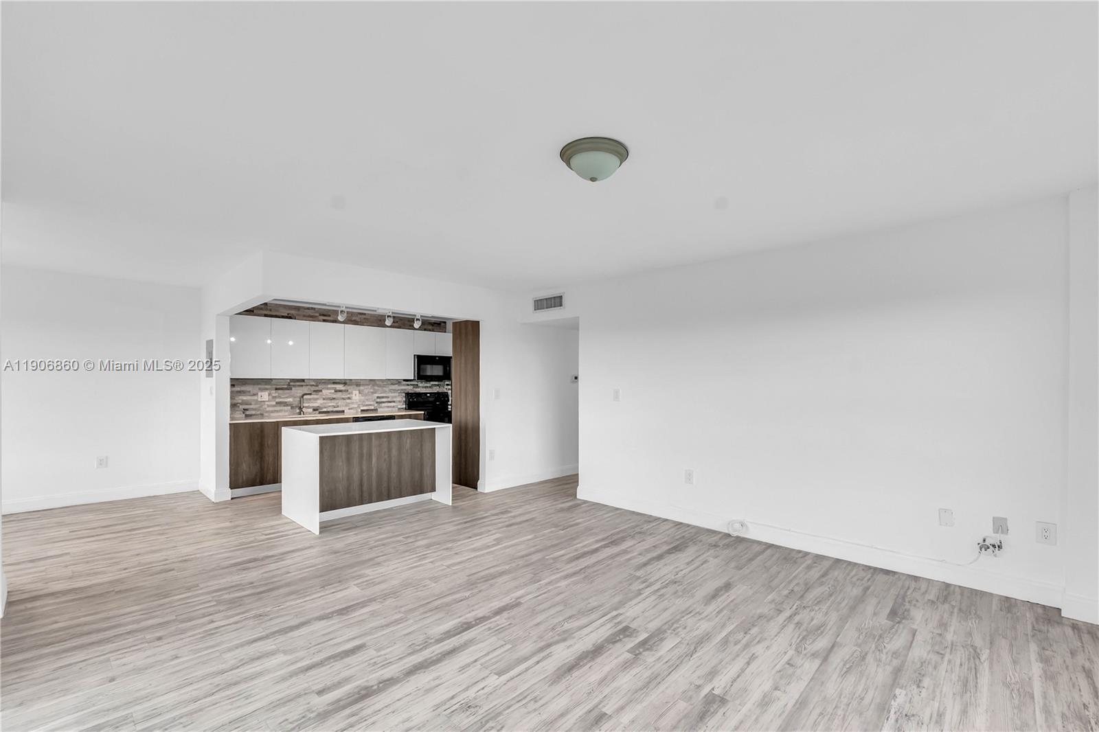 4164 Inverrary Drive, Unit 801 Lauderhill, FL 33319 - Photo 4 of 20 a kitchen with a refrigerator and white stove top oven