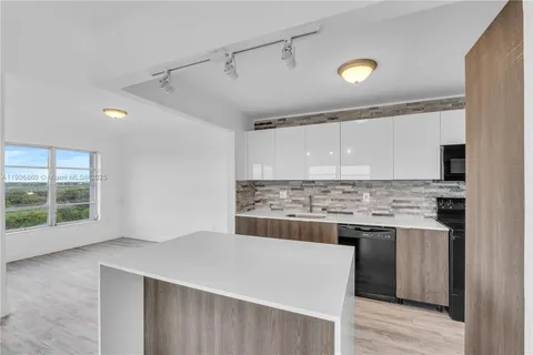 a kitchen with a stove and a sink