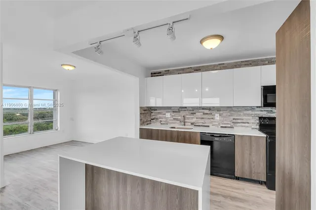 a kitchen with a stove and a sink