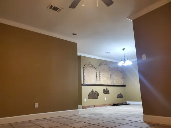 a view of a windows and chandelier in a room