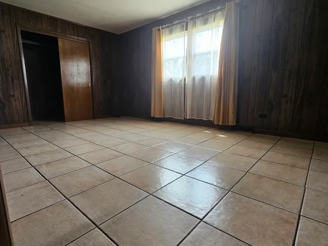 a view of an empty room and window