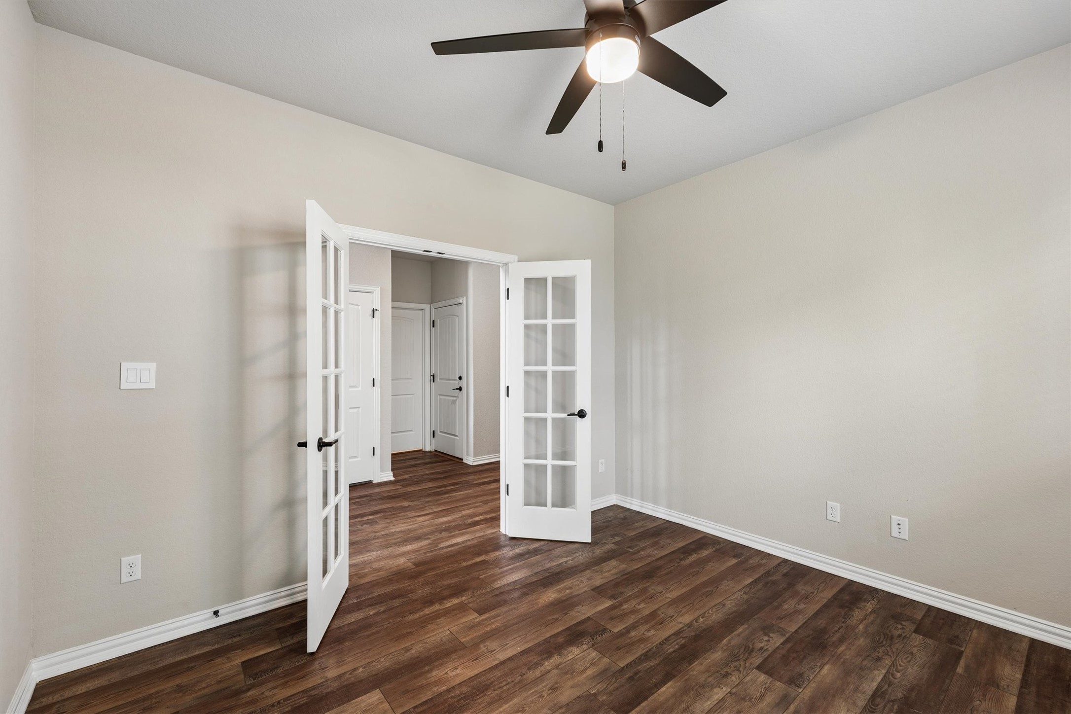 324 Autumn Oak Way Georgetown, TX 78628 - Photo 15 of 40 Room featuring wood-finish flooring, light neutral wall tones, and white trim