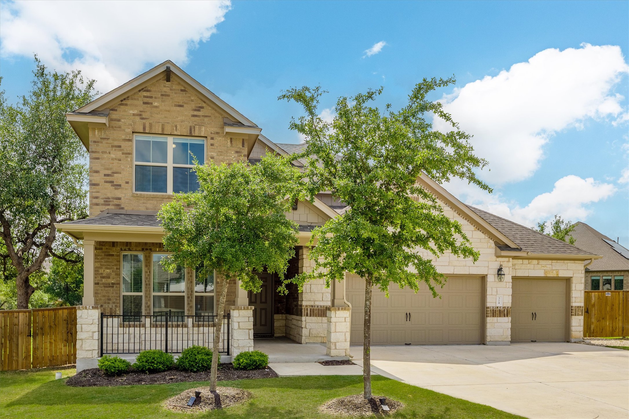 324 Autumn Oak Way Georgetown, TX 78628 - Photo 2 of 40 Brick and stone façade with gabled roof lines