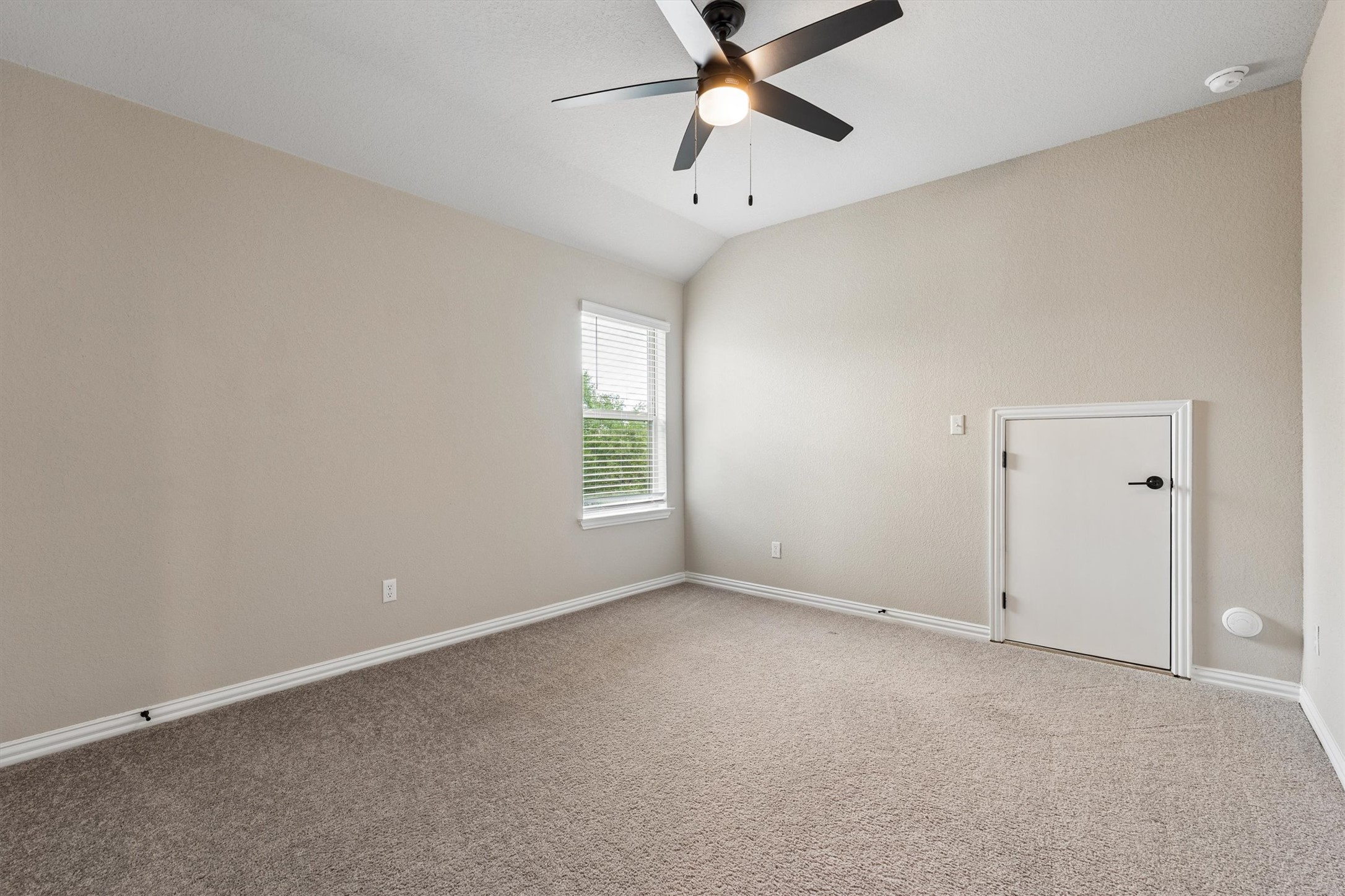 324 Autumn Oak Way Georgetown, TX 78628 - Photo 29 of 40 Room with vaulted ceiling, neutral carpet, and a ceiling fan with integrated lighting
