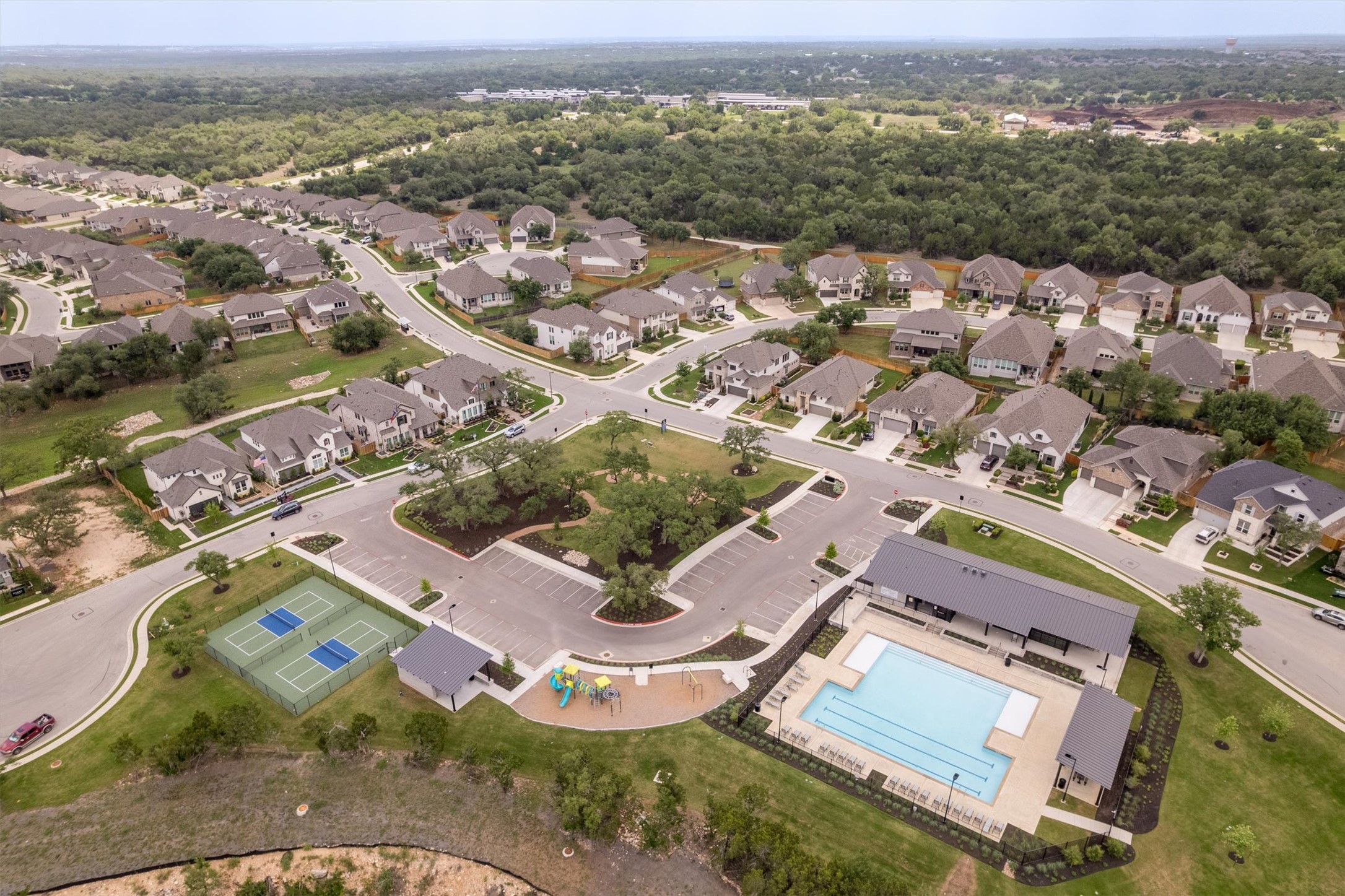 324 Autumn Oak Way Georgetown, TX 78628 - Photo 39 of 40 Community amenities featuring a swimming pool, covered pavilion, two tennis courts, and a playground