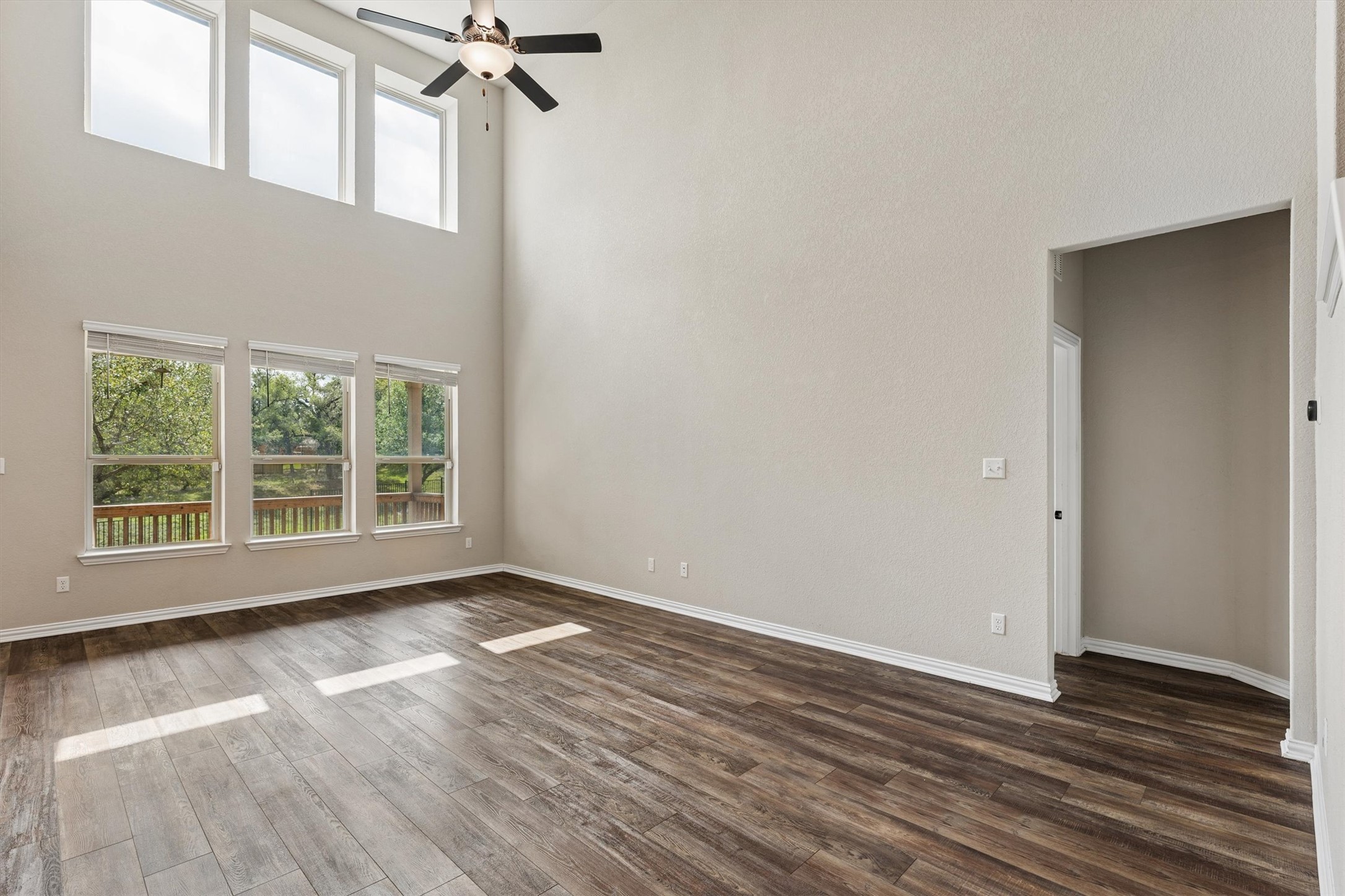 324 Autumn Oak Way Georgetown, TX 78628 - Photo 5 of 40 Expansive room featuring high ceilings and wood-finish flooring