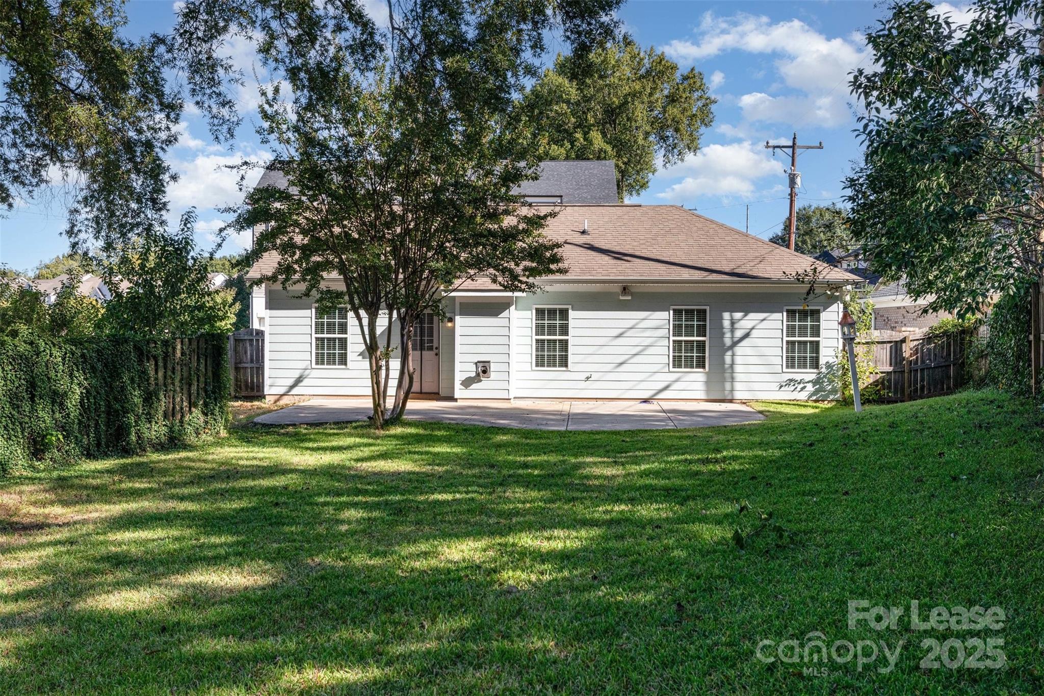 540 Greystone Road Charlotte, NC 28209 - Photo 18 of 18 a backyard of a house with table and chairs