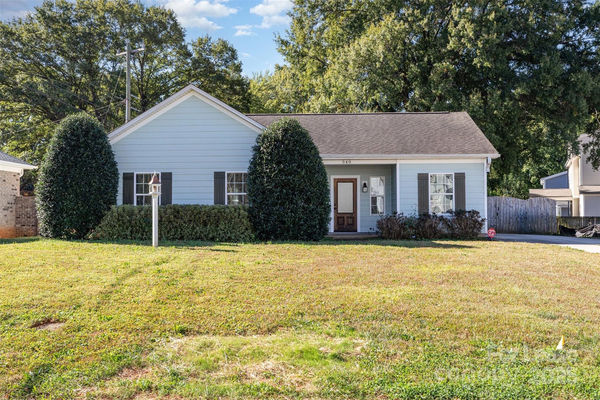 540 Greystone Road Charlotte, NC 28209 - Photo 2 of 18 a front view of house with yard and trees in the background