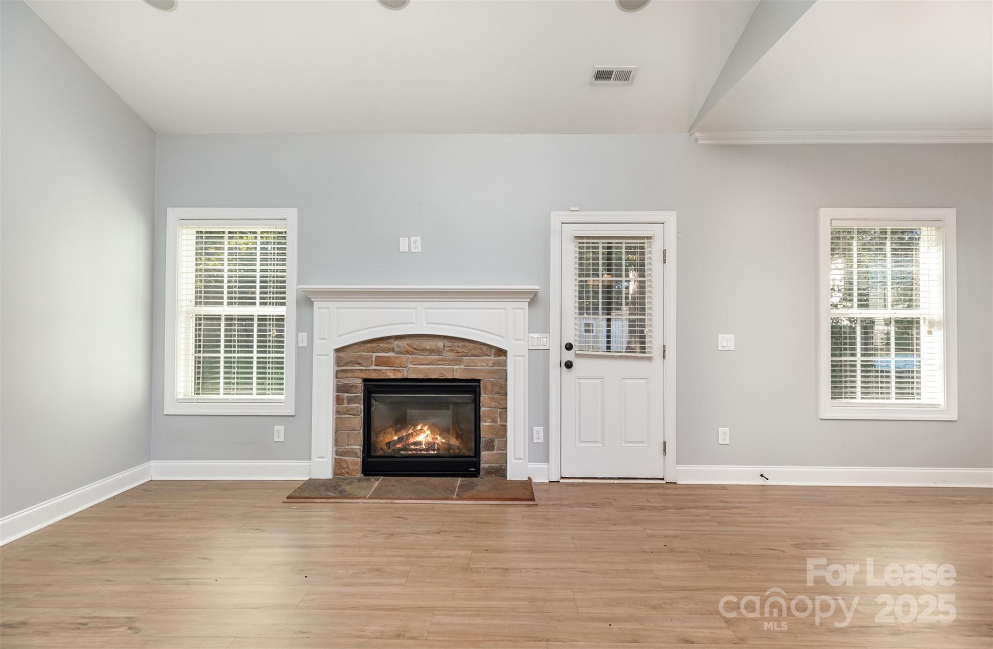 540 Greystone Road Charlotte, NC 28209 - Photo 3 of 18 a view of an empty room with wooden floor and a window
