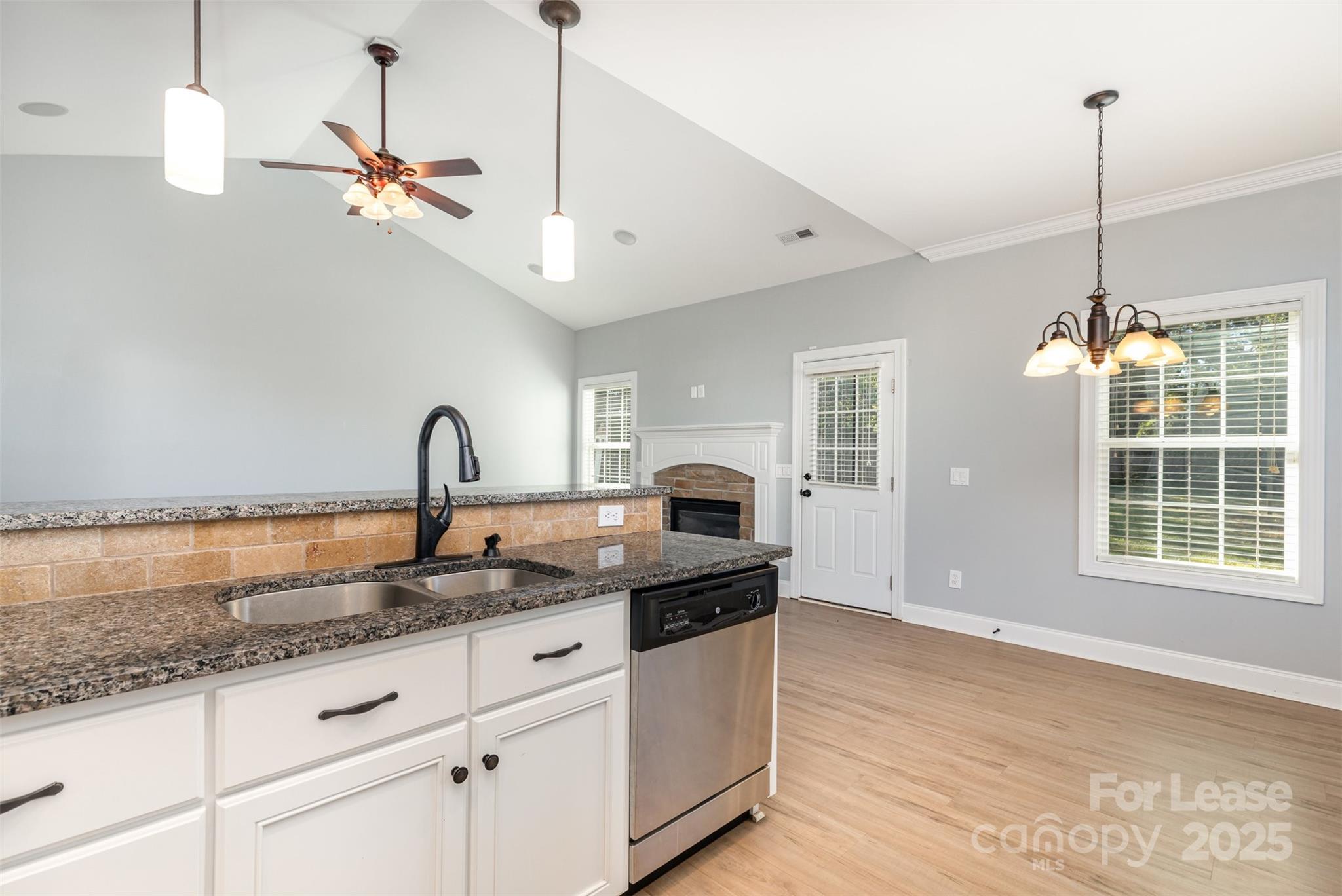 540 Greystone Road Charlotte, NC 28209 - Photo 7 of 18 a kitchen with granite countertop a sink a counter top space and cabinets